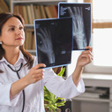 Female doctor examining X-ray